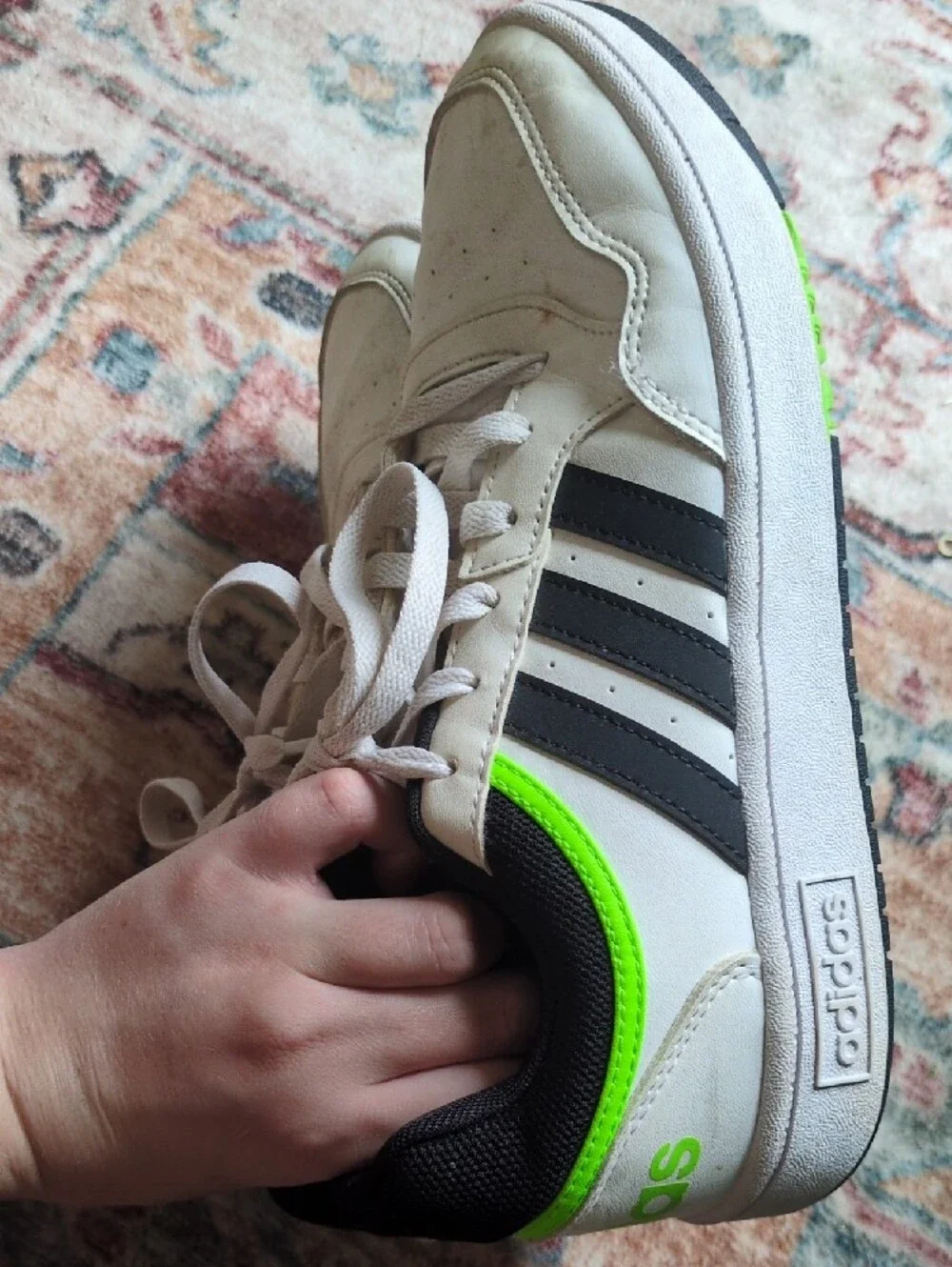 White Adidas Sneakers with Black Stripes and Neon Green Accent